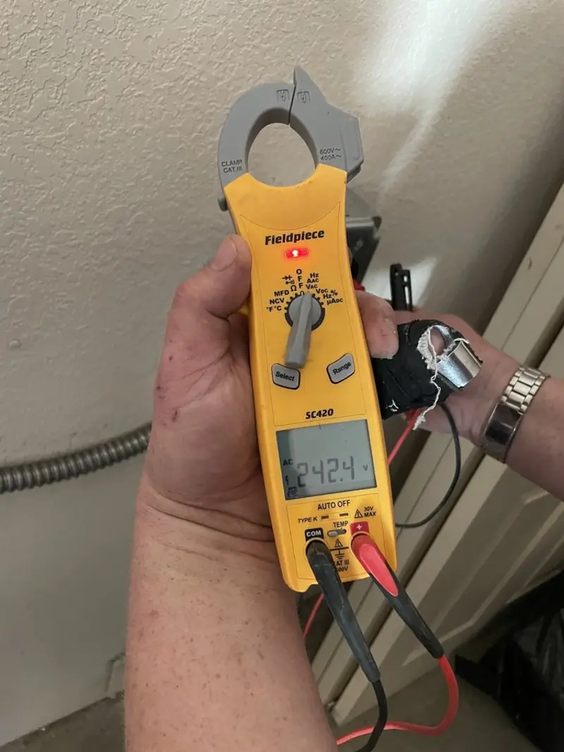 Voltage testing with clamp meter during Ceiling Fan Installation in Wheeling